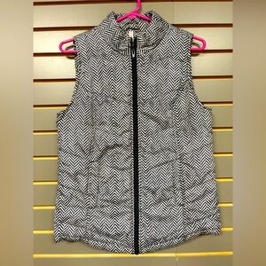 Puffy zippered vest, women’s size S, black/white chevron pattern.